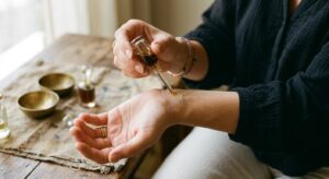 Applying alcohol-free attar perfume to the wrist